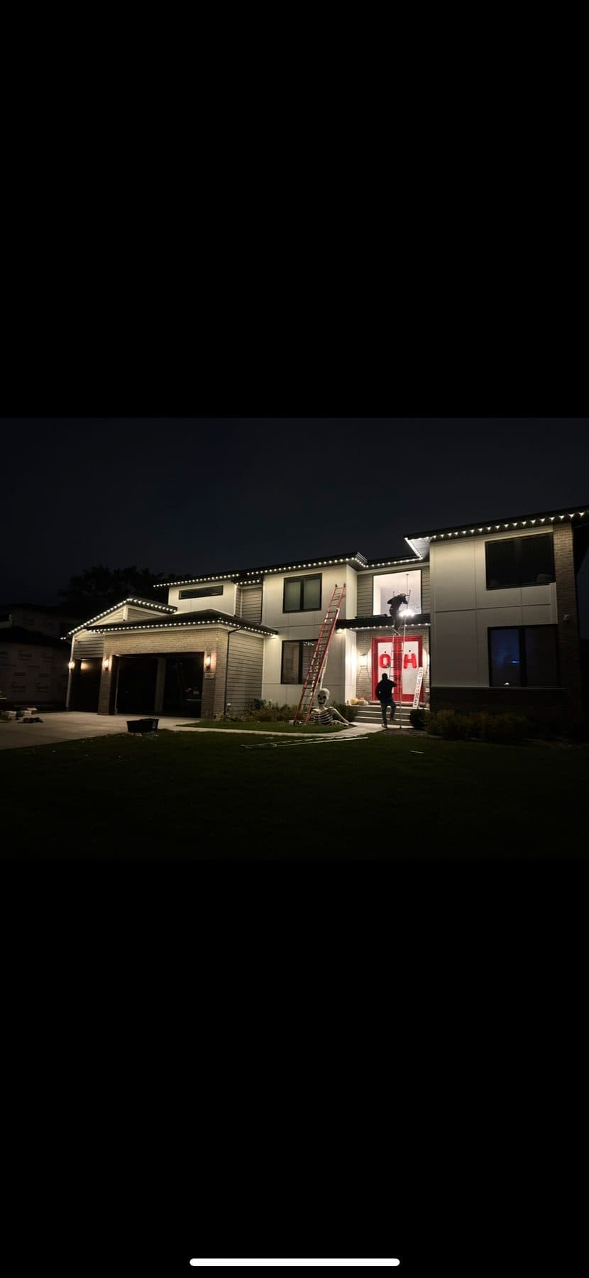 TruLight Chicago installers mounting permanent roofline lighting during a one-day install