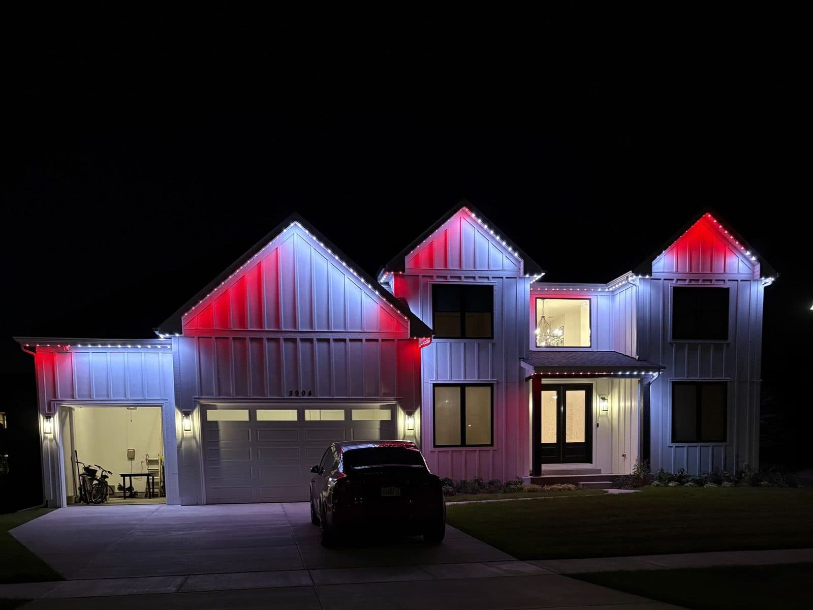 Modern farmhouse in Naperville, IL with color-changing permanent lights in a custom scene